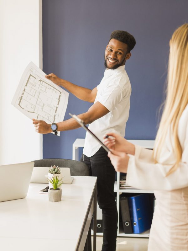 cheerful-man-showing-draft-woman